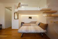 Posteľ alebo postele v izbe v ubytovaní Siena UpTown - Sabrina's Cozy Apartment