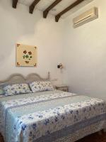 Posteľ alebo postele v izbe v ubytovaní Hotel Meson Fuente del Pino