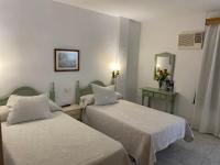 Posteľ alebo postele v izbe v ubytovaní Hotel Meson Fuente del Pino