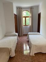 Posteľ alebo postele v izbe v ubytovaní Hotel Meson Fuente del Pino