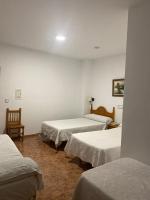 Posteľ alebo postele v izbe v ubytovaní Hotel Meson Fuente del Pino