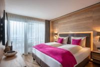 Łóżko lub łóżka w pokoju w obiekcie Hotel Adapura Wagrain