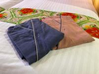 two pieces of clothing laying on a bed at Kyoto Inn Gion The Second in Kyoto
