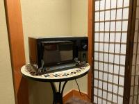 a microwave sitting on a table in a room at Kyoto Inn Gion The Second in Kyoto