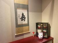 a room with a table with a figurine on it at Kyoto Inn Gion The Second in Kyoto