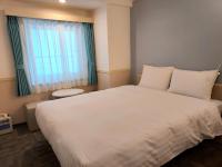 Toyoko Inn Changwonにあるベッド
