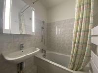 a bathroom with a sink and a tub and a mirror at Appartement Sainte-Maxime, 2 pièces, 4 personnes - FR-1-226-500 in Sainte-Maxime