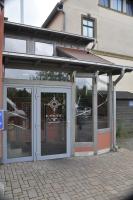 a store front with glass doors on a building at U-Nautic Restaurant &amp; Pension in Waren