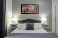 A bed or beds in a room at Rhome Guest House