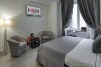 A bed or beds in a room at Rhome Guest House