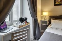 A bed or beds in a room at Rhome Guest House