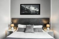 A bed or beds in a room at Rhome Guest House