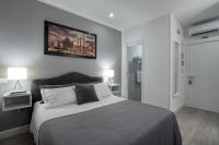 A bed or beds in a room at Rhome Guest House