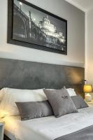 A bed or beds in a room at Rhome Guest House
