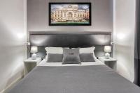 A bed or beds in a room at Rhome Guest House