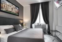 A bed or beds in a room at Rhome Guest House
