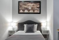 A bed or beds in a room at Rhome Guest House