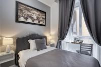 A bed or beds in a room at Rhome Guest House
