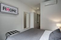 A bed or beds in a room at Rhome Guest House