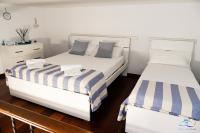 Posteľ alebo postele v izbe v ubytovaní Holiday House Piccirillo