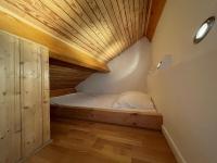 Łóżko lub łóżka w pokoju w obiekcie Appartement dernier étage 3 chambres - Olympe