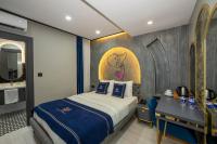 A bed or beds in a room at Hotel California