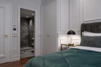 Posteľ alebo postele v izbe v ubytovaní Praxitelous Luxury Suites