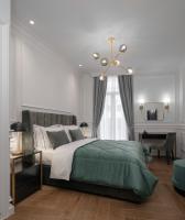 Posteľ alebo postele v izbe v ubytovaní Praxitelous Luxury Suites