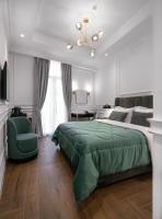Posteľ alebo postele v izbe v ubytovaní Praxitelous Luxury Suites