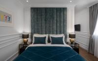 Posteľ alebo postele v izbe v ubytovaní Praxitelous Luxury Suites