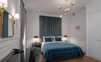 Posteľ alebo postele v izbe v ubytovaní Praxitelous Luxury Suites