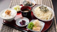 a tray of food with noodles and bowls of food at Onsen Urashima in Onomichi
