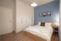 A bed or beds in a room at Exclusive apartment in the heart of Athens