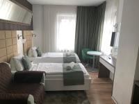 Posteľ alebo postele v izbe v ubytovaní VIP Apartments