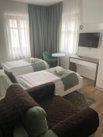 Posteľ alebo postele v izbe v ubytovaní VIP Apartments