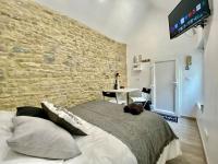 Posteľ alebo postele v izbe v ubytovaní Bed in the city - APPART’HOTEL - Historical center