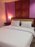 Postel nebo postele na pokoji v ubytování Krabi Orchid Hometel