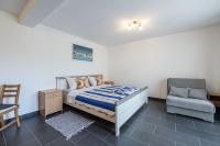 Posteľ alebo postele v izbe v ubytovaní Apartments Small pleasure