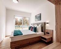 Posteľ alebo postele v izbe v ubytovaní Tanners Chalet Apartments
