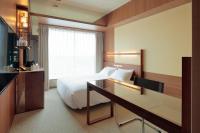 カンデオホテルズ宇都宮にあるベッド