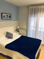 Posteľ alebo postele v izbe v ubytovaní Pensión Gárate