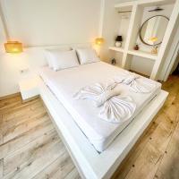 Postel nebo postele na pokoji v ubytování Aloha Suites