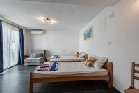 Posteľ alebo postele v izbe v ubytovaní Apartments Small pleasure
