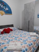 Łóżko lub łóżka w pokoju w obiekcie Etna Bella Home