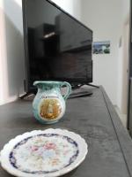 Telewizja i/lub zestaw kina domowego w obiekcie Etna Bella Home