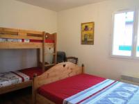 a bedroom with two bunk beds and a window at Appartement Villard-de-Lans, 3 pièces, 6 personnes - FR-1-689-4 in Villard-de-Lans