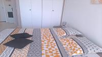 Łóżko lub łóżka w pokoju w obiekcie Patio Fleuri