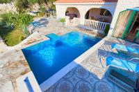 a swimming pool in the middle of a house at Villa Sonnhaus in Marina