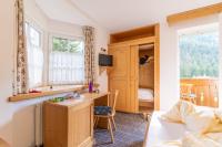 A television and/or entertainment centre at Albergo Canazei