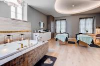 a bathroom with a tub and a kitchen and a room at Fleur de Loire in Blois